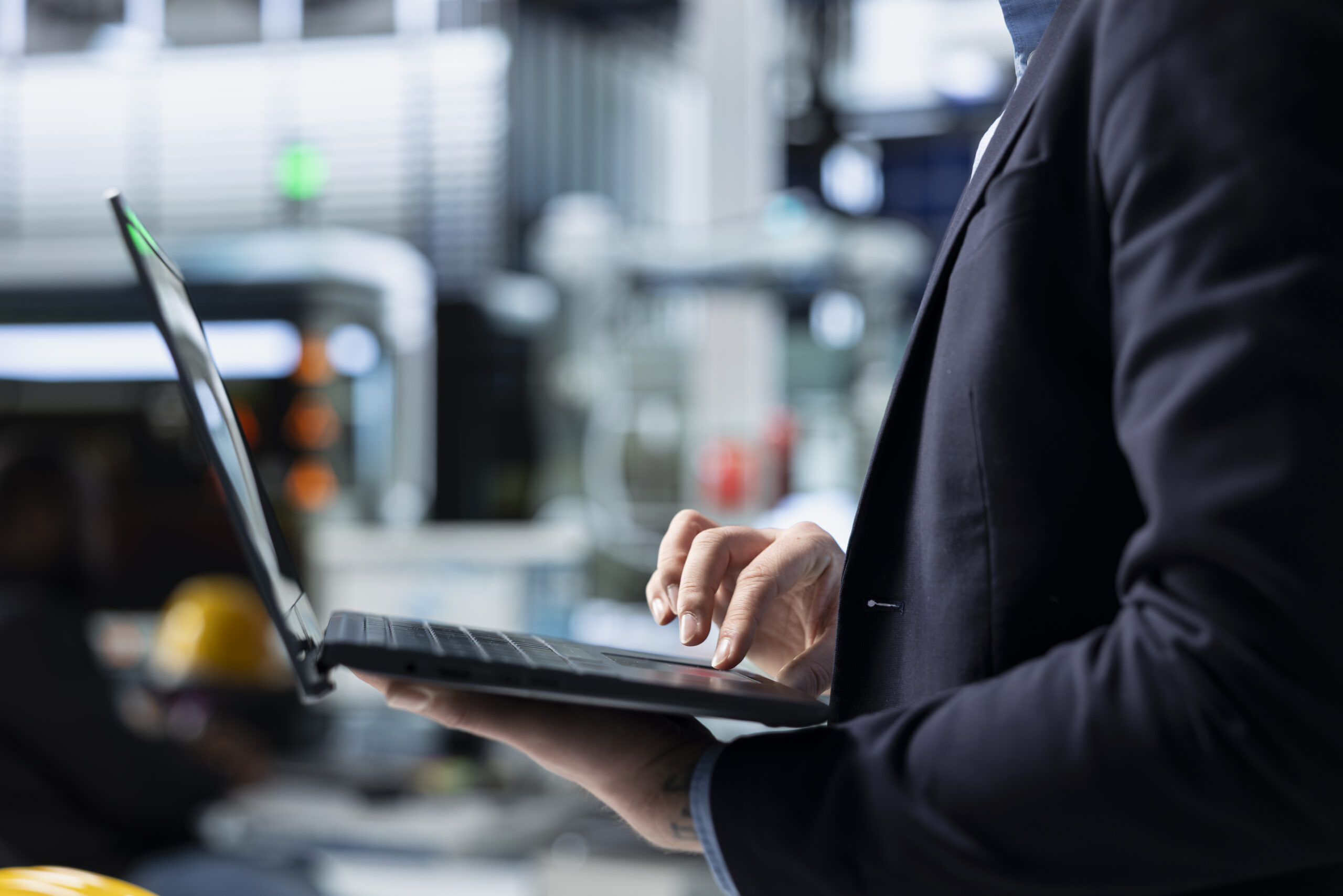 industrial business analyst in suit inspecting renewable energy equipment